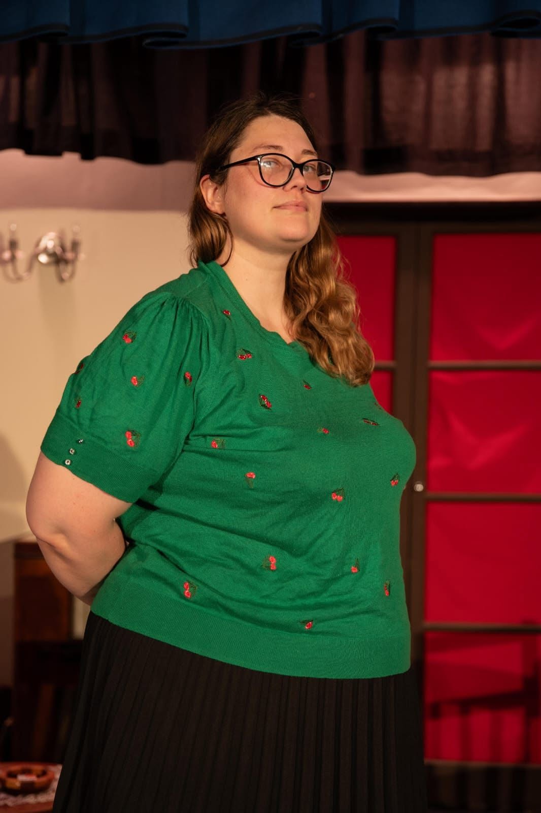 A Blithe Spirit cast member performing on the drawing-room set