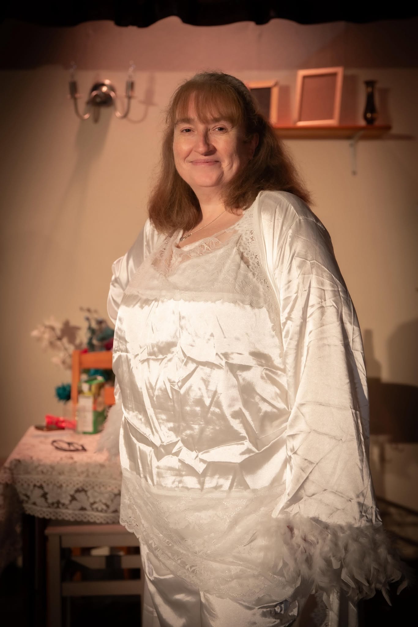 A Blithe Spirit cast member in a white ghostly costume